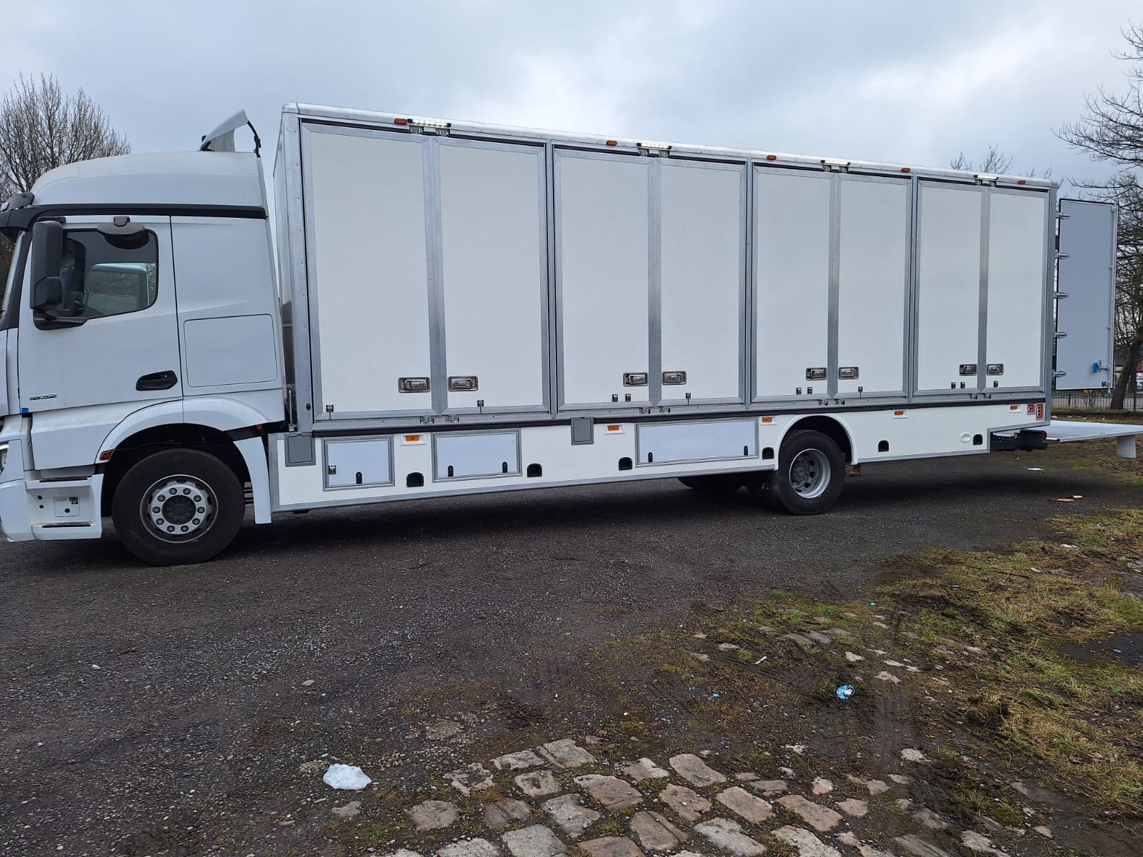 Furniture Removal Van - Professional multi-compartment commercial vehicle body with individual access doors